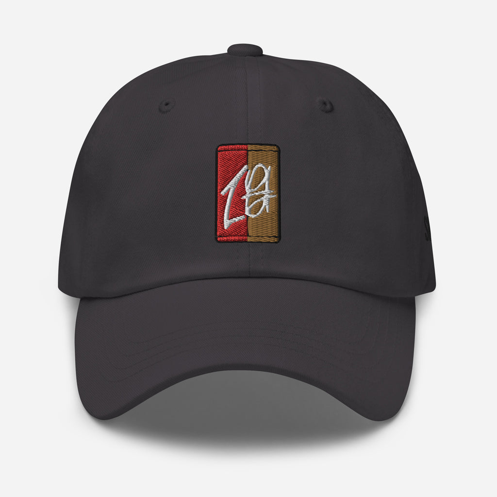 "Charcoal Gray dad hat with a black embroidered brand logo. The hat features a classic design and a comfortable fit, making it a great accessory for any casual outfit. The embroidered logo adds a touch of style and brand recognition, making it a great choice for fans of the brand."