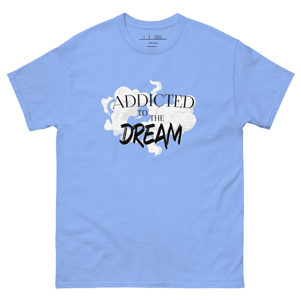 "Blue-shirt with white text that reads 'Addicted to the Dream.' The shirt features a stylish font and is perfect for casual wear. The design conveys a sense of passion and drive, making it a great choice for anyone who is focused on achieving their goals."