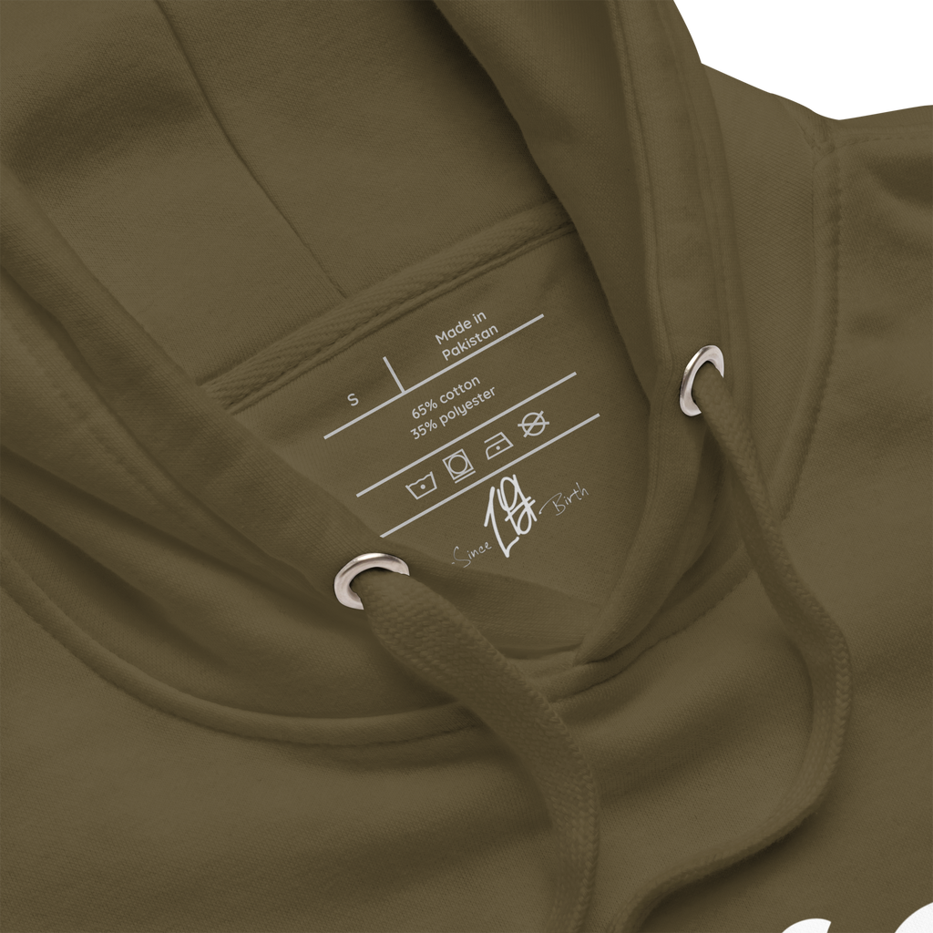 "Military Green hoodie with white text that reads 'Since Birth.' The hoodie features a stylish font and is perfect for casual wear. The design conveys a sense of passion and drive, making it a great choice for anyone who is focused on achieving their goals."